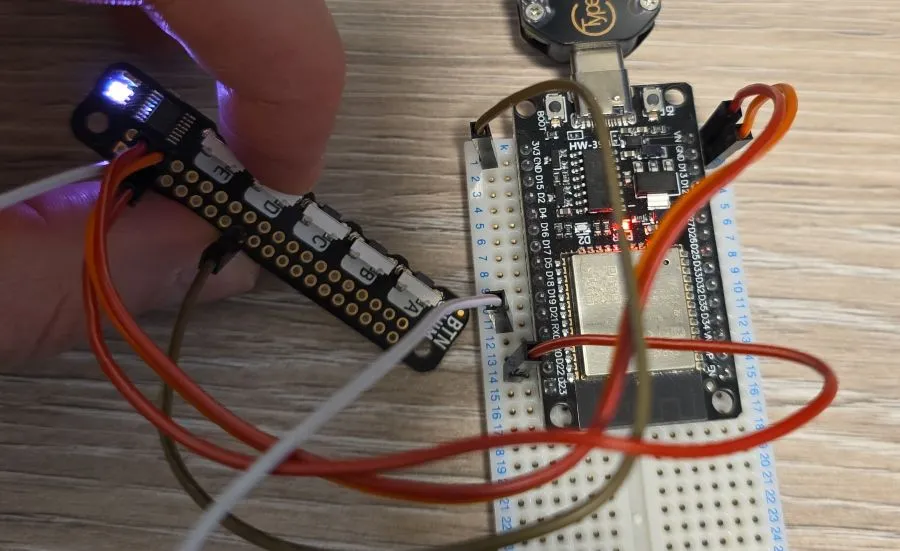 Photo of the button shim with button D pressed and LED showing white